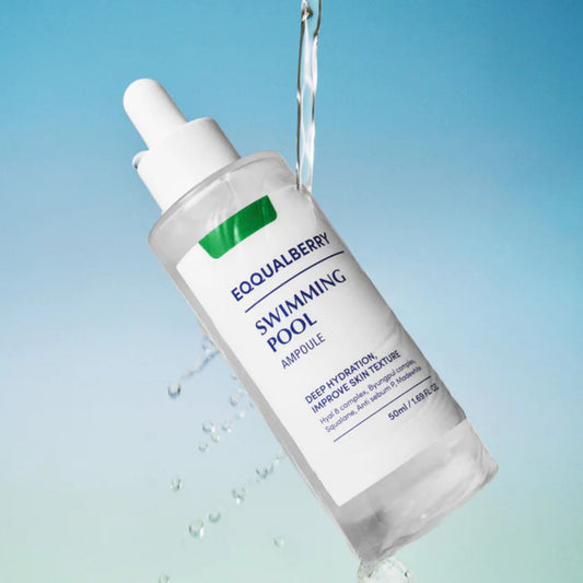Skincare bottle labeled 'Equalberry Swimming Pool Ampoule' with water droplets on a gradient blue background