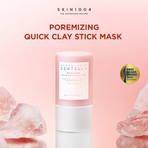 SKIN1004 Poremitizing Quick Clay Stick Mask on a pink background with natural elements.