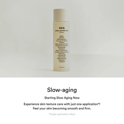 Skincare bottle labeled 'Abib' on a light gray background with promotional text about slow aging.