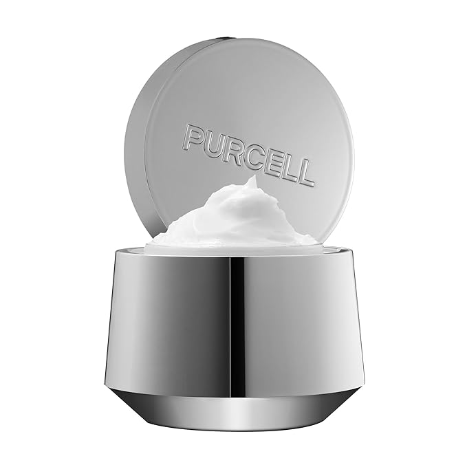 Silver jar of Purcell cream with white cream inside on a white background