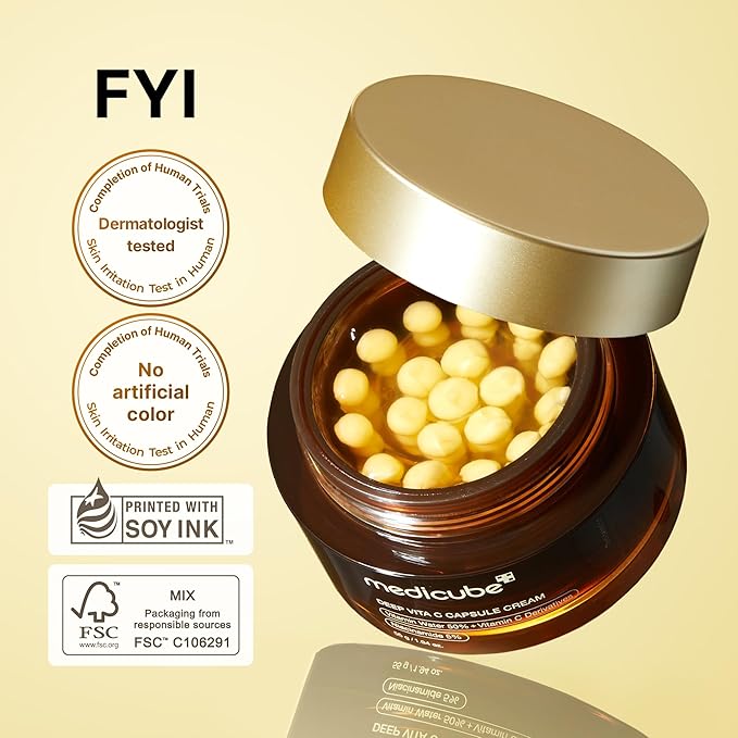 Jar of capsules with a gold lid on a beige background, featuring 'FYI' branding and sustainability labels.