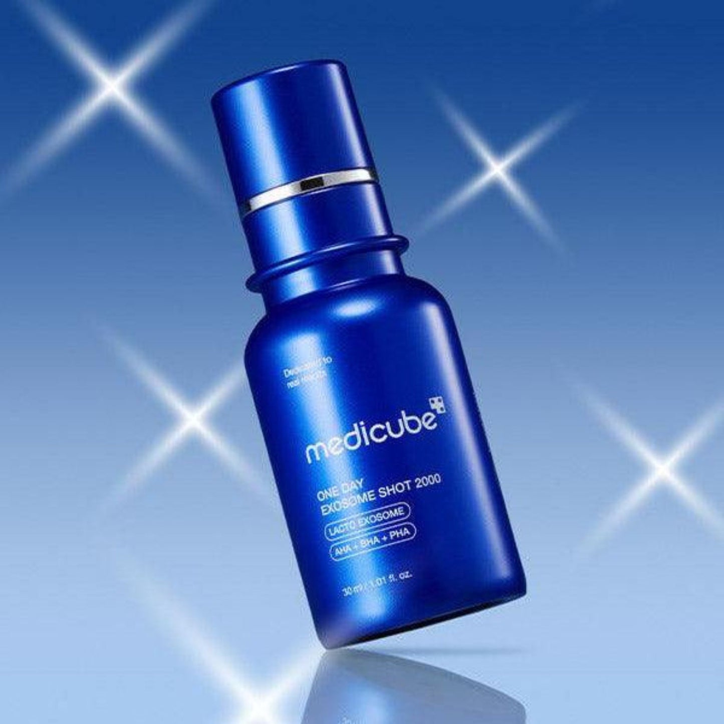 Blue Medicube serum bottle on a blue background with starlight effects