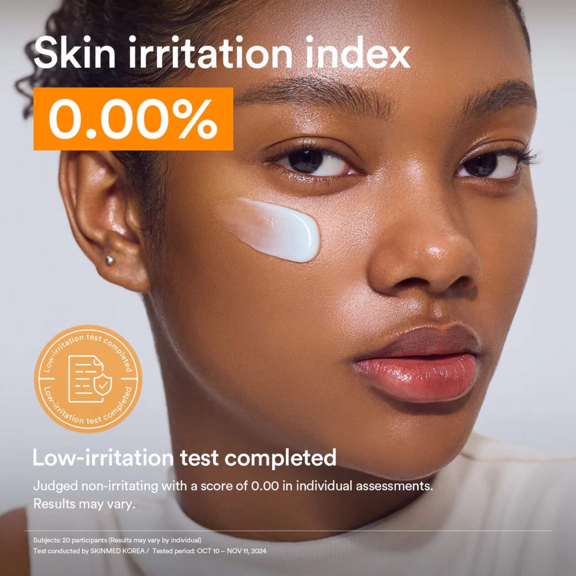Woman with a patch on her face, indicating a skin irritation index of 0.00%, with a white background.