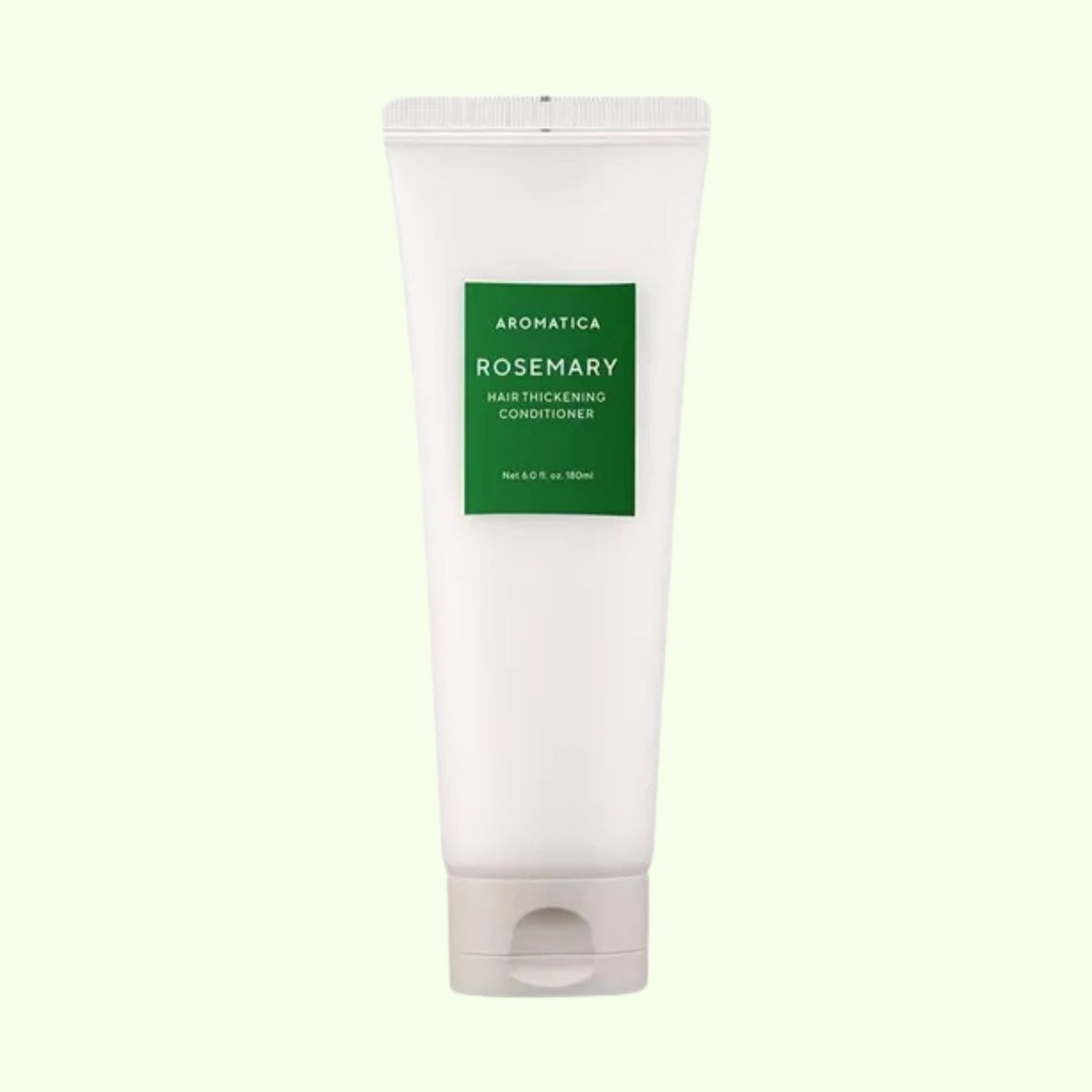 Aromatica Rosemary hair thickening conditioner tube on a light green background