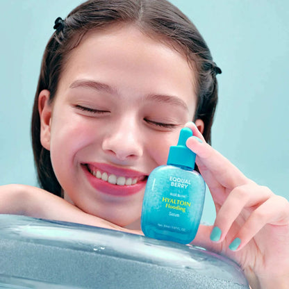 Girl holding a blue bottle labeled 'Equal Berry' against a light blue background