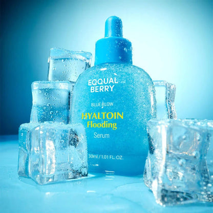 Blue skincare serum bottle with ice cubes on a blue background