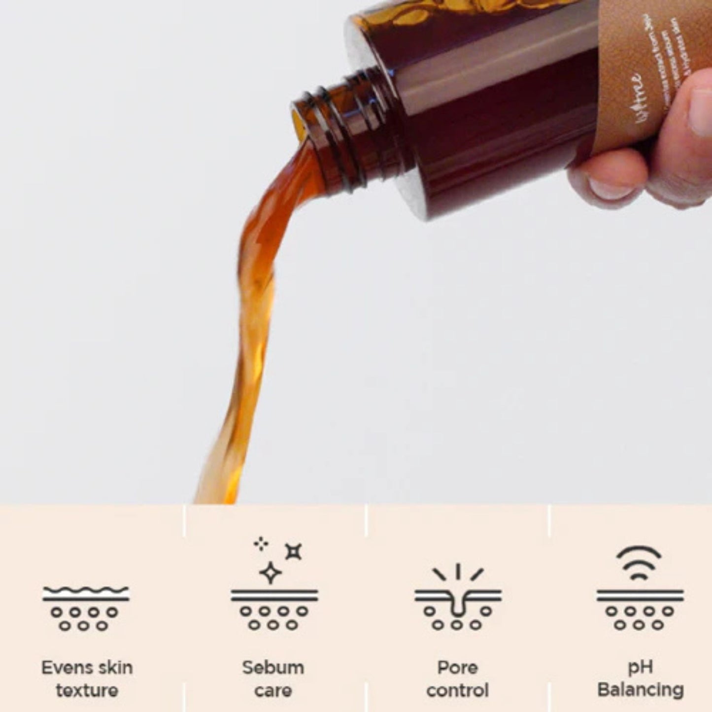 Hand pouring a brown liquid from a bottle labeled 'L'oreal' onto a white background with icons and text about product benefits.