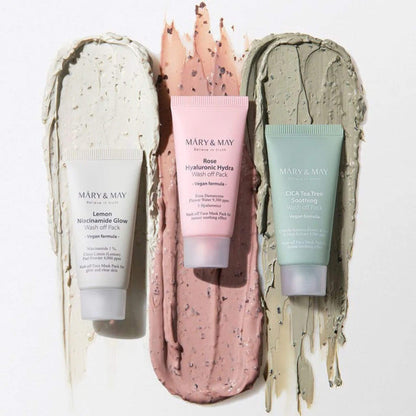 Three skincare products with visible brand 'MARY & MAY' on a textured background