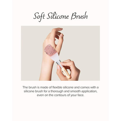 Hand using a soft silicone brush on skin with text describing its features.