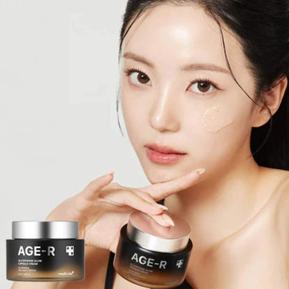 Woman holding two jars of AGE-R skincare product against a white background