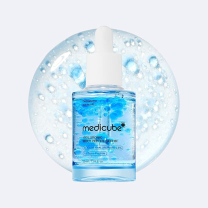 Medicube serum bottle with dropper on a light blue background