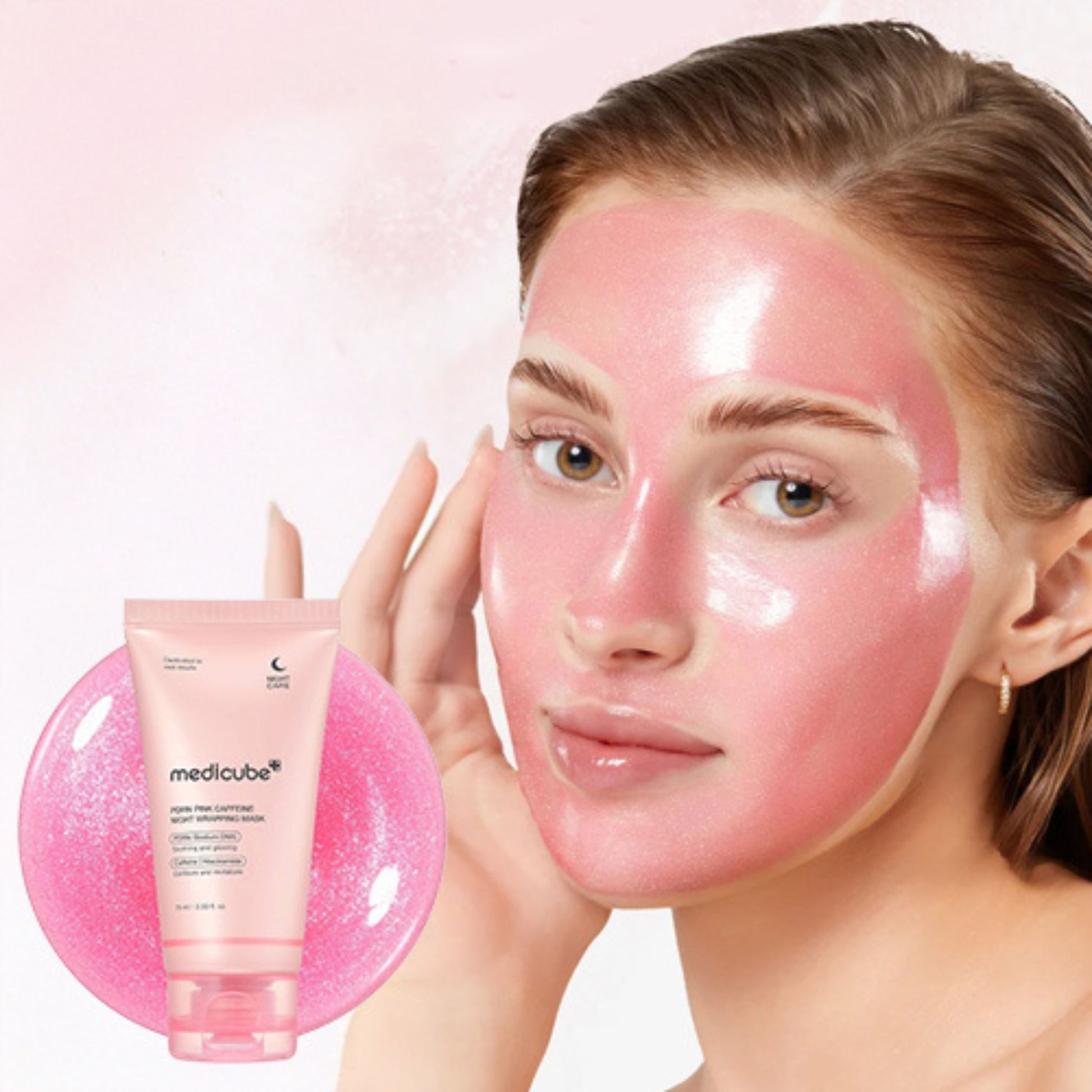Woman with pink facial mask on one side of her face, holding a Medicube product.