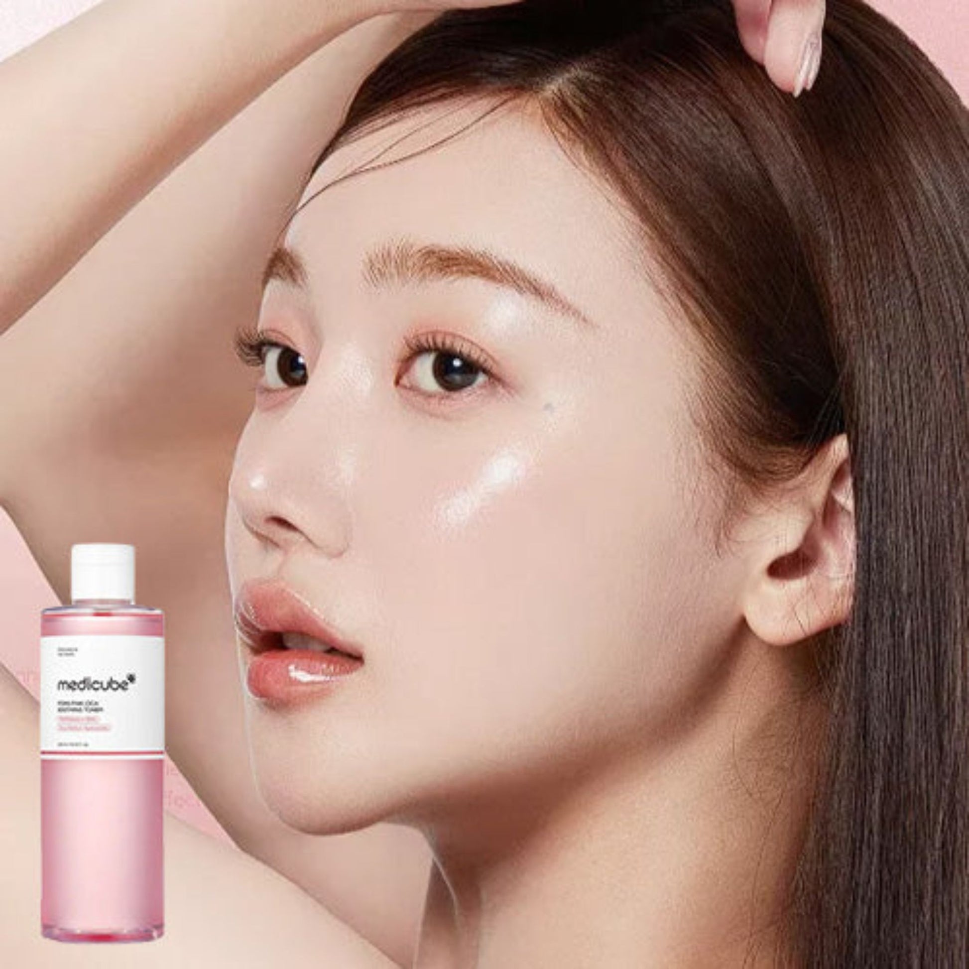 Woman with smooth skin holding a Medicube skincare product
