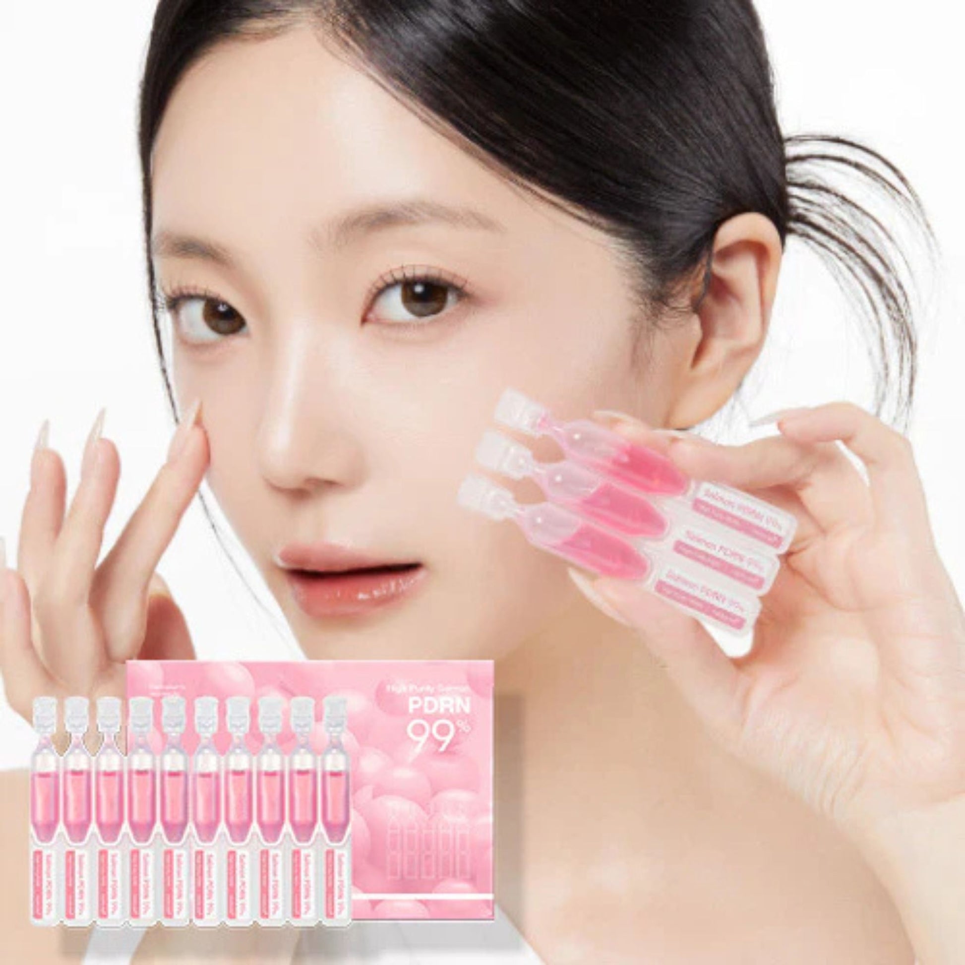 Woman holding a set of pink skincare products with a clear box in the foreground.