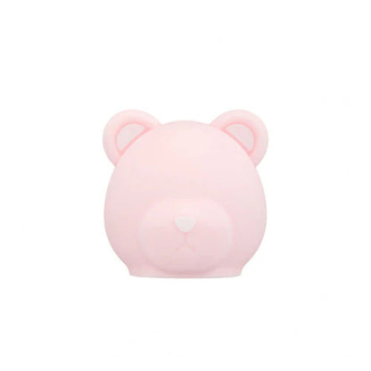 Pink bear-shaped container on a white background