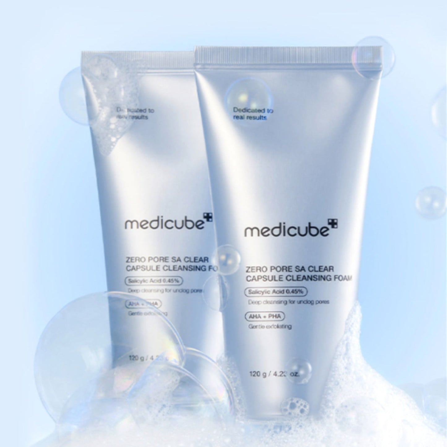 Two bottles of Medicube Zero Pore SA Clear Capsule Cleansing Foam on a light blue background.