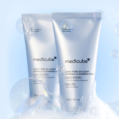 Two bottles of Medicube Zero Pore SA Clear Capsule Cleansing Foam on a light blue background.