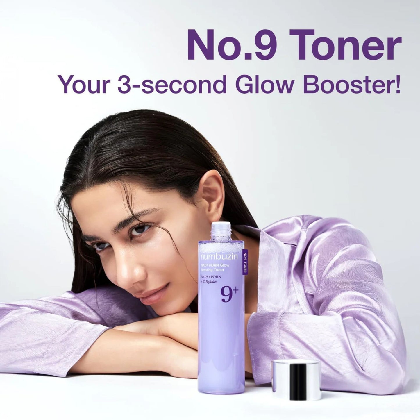 Woman with a bottle of No.9 Toner on a light purple background