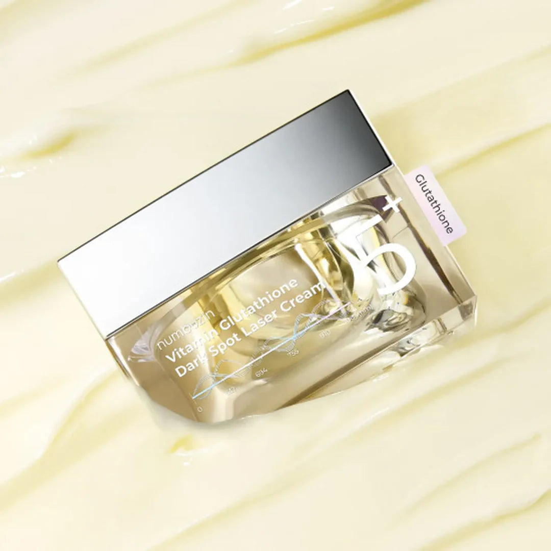 Cosmetic jar with a silver lid on a light yellow background