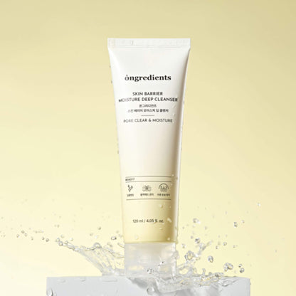 Skincare cleanser tube labeled 'ongredients' on a light yellow background with water droplets.