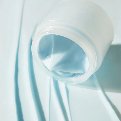 Close-up of a roll of light blue fabric on a white background