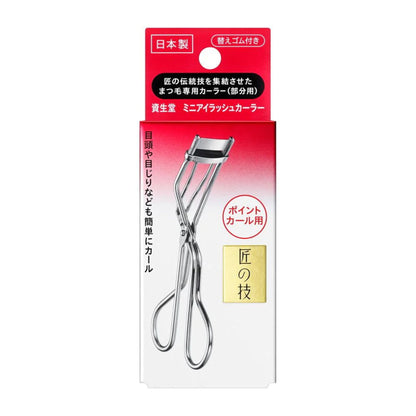 Eyelash curler in packaging with Japanese text on a white background