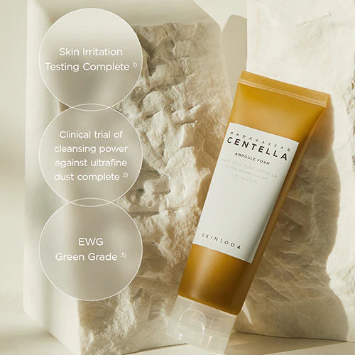 Skincare product with text on a textured stone background