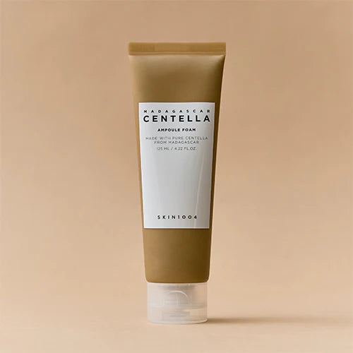 Skincare tube labeled 'Madagascar Centella' on a beige background