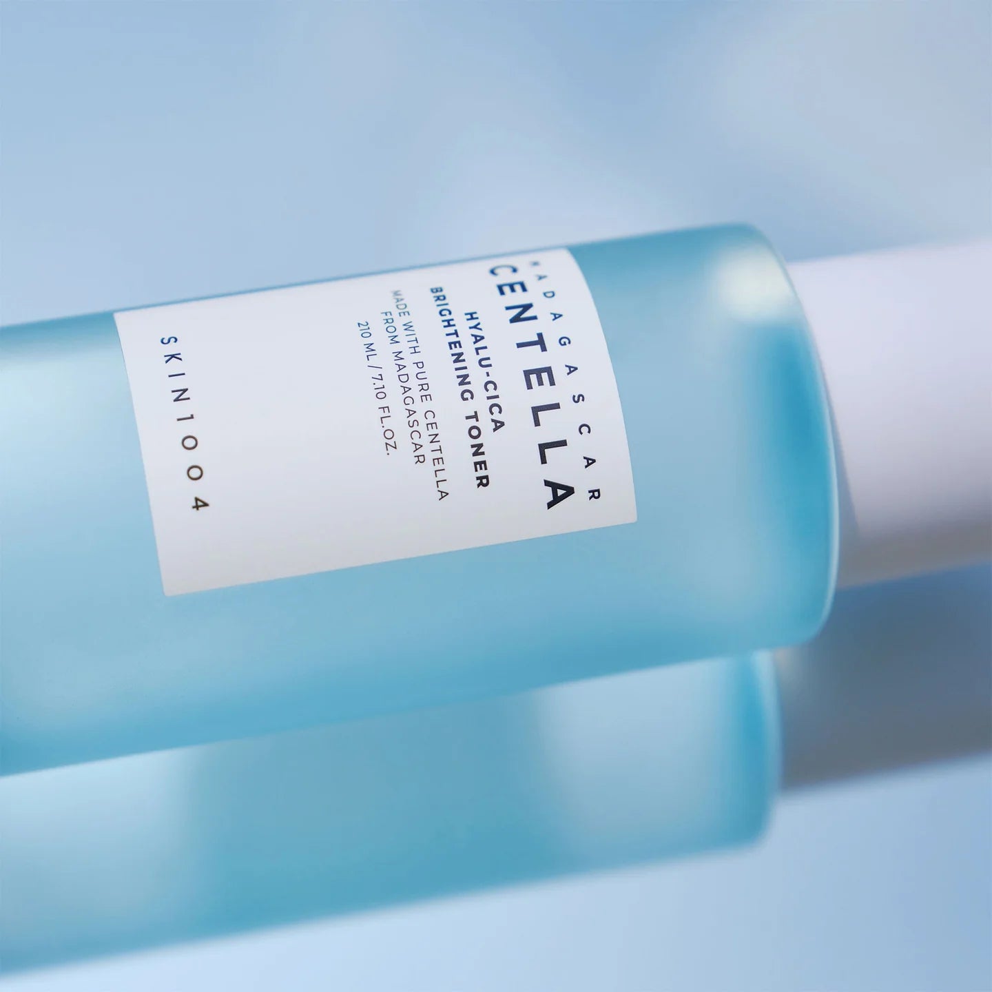 Skintoo Centella Asiatica toner bottle on a light blue background