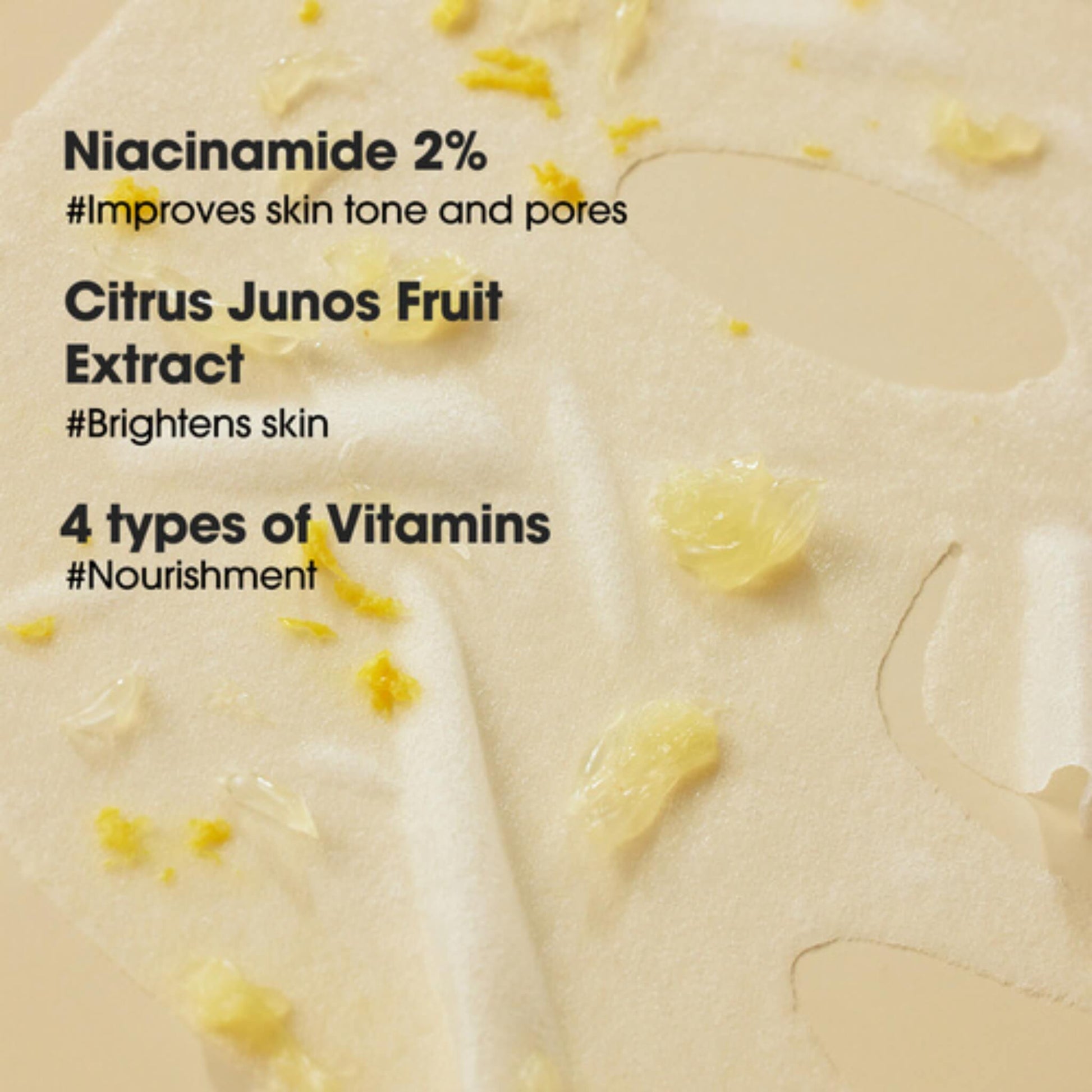 Product with text highlighting Niacinamide, Citrus Junos Fruit Extract, and vitamins on a beige background.