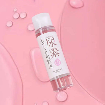 Skincare bottle with Japanese text on a pink background